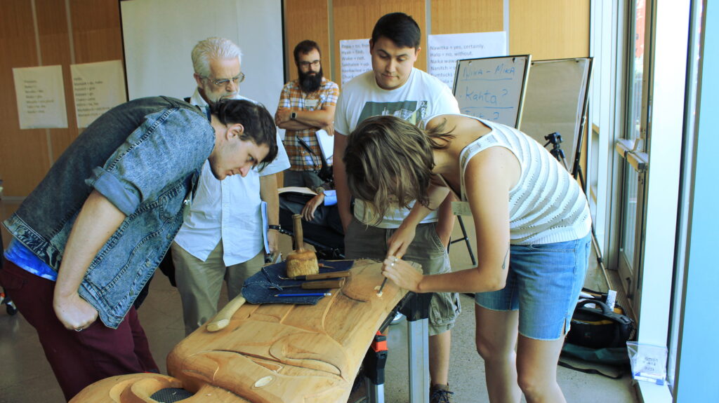 Students try their hand at wood carving.